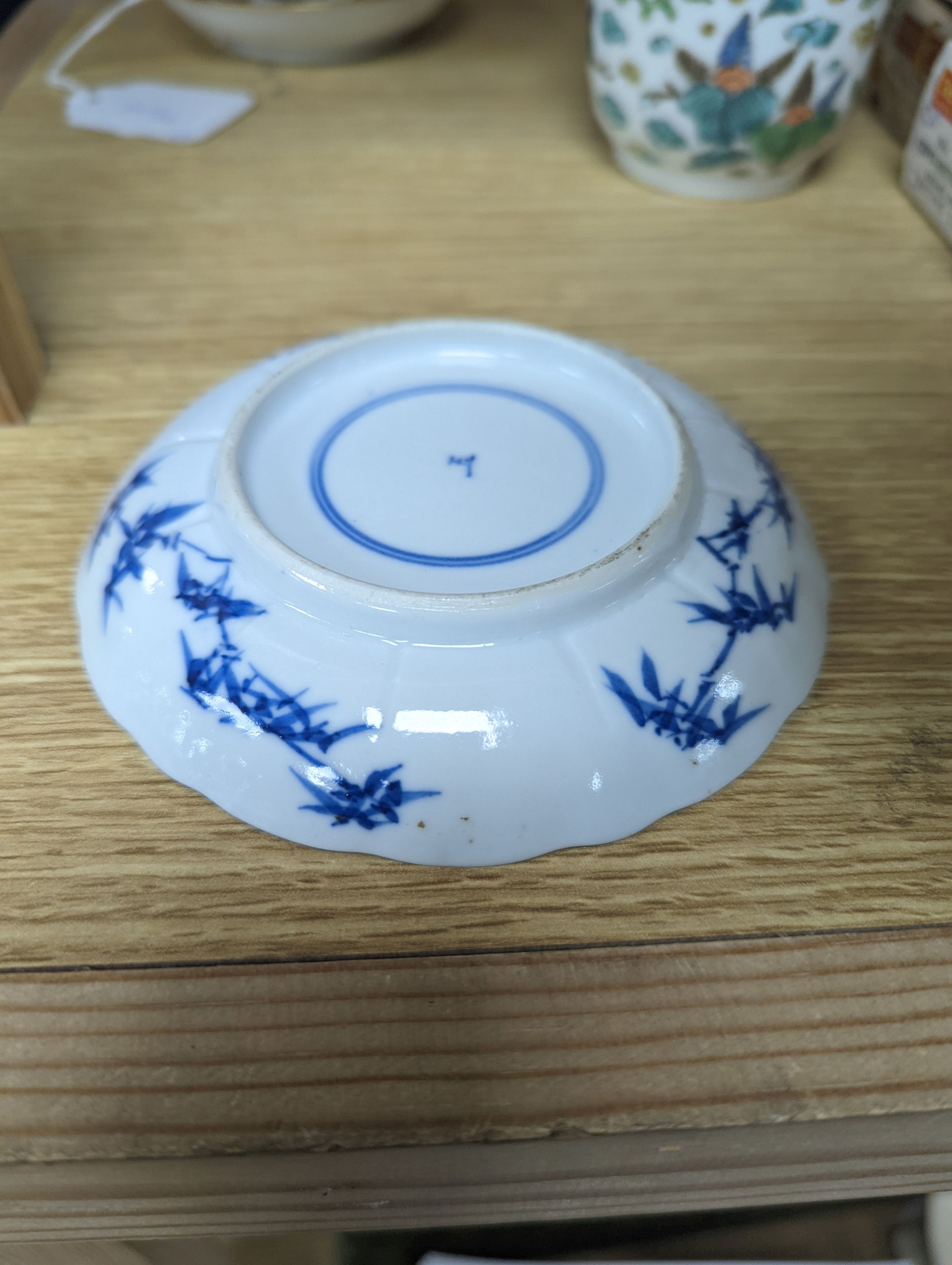 Two Chinese porcelain saucer dishes and an enamelled porcelain vase, 18th century and later, 12.5cm